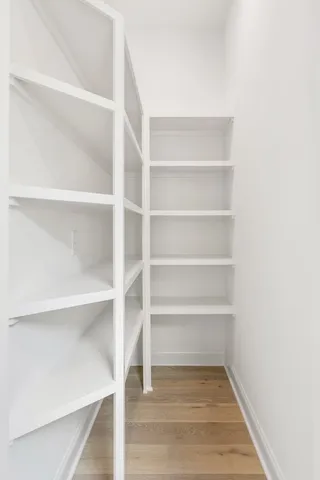 a view of a room with shelf on the wall
