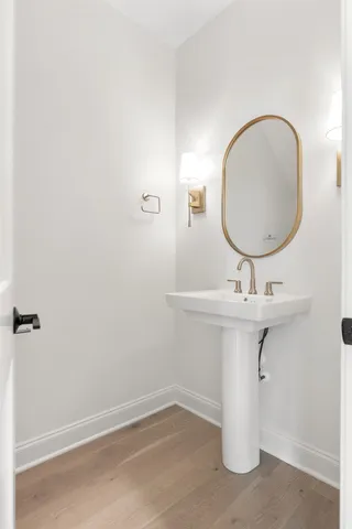 a bathroom with a sink a mirror and vanity