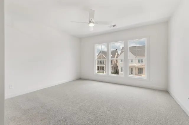 an empty room with a fireplace