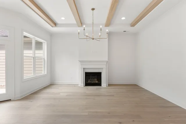 a view of an empty room with a fireplace