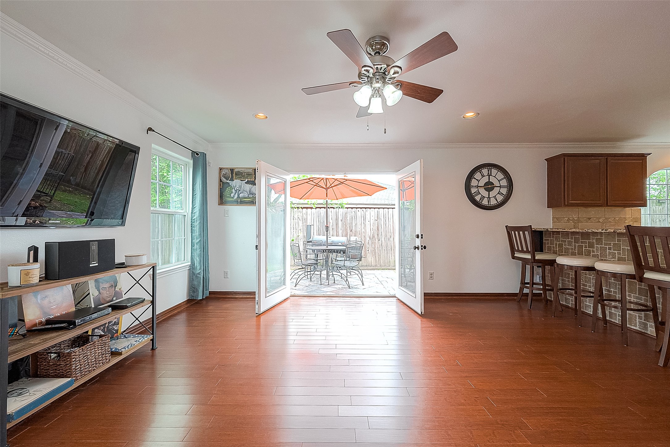 6703 Winton Street Houston, TX 77021 - Photo 22 of 49 French doors open to relaxing patio space with furniture and smoker