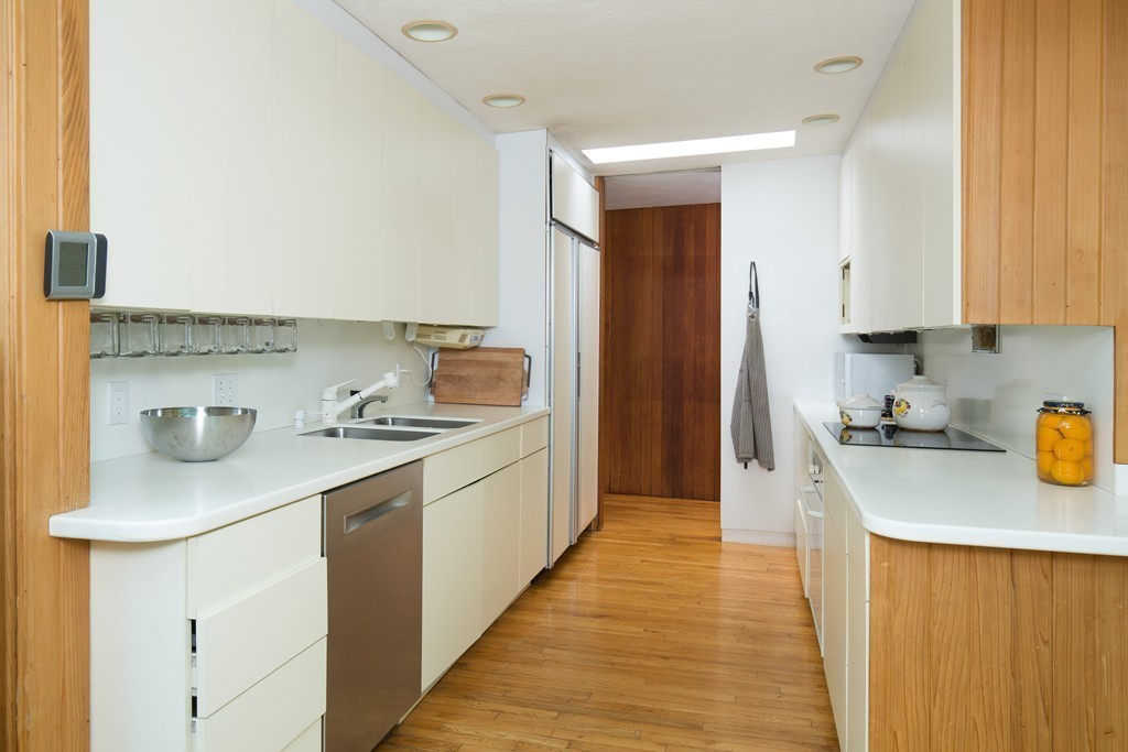 28 Barberry Road Lexington, MA 02421 - Photo 6 of 11 a kitchen with a sink stove and cabinets
