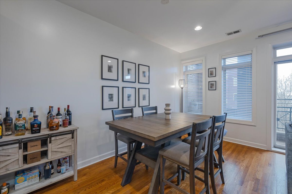 2130 West Rice Street, Unit 4 Chicago, IL 60622 - Photo 16 of 35 a view of a dining room with furniture and wooden floor
