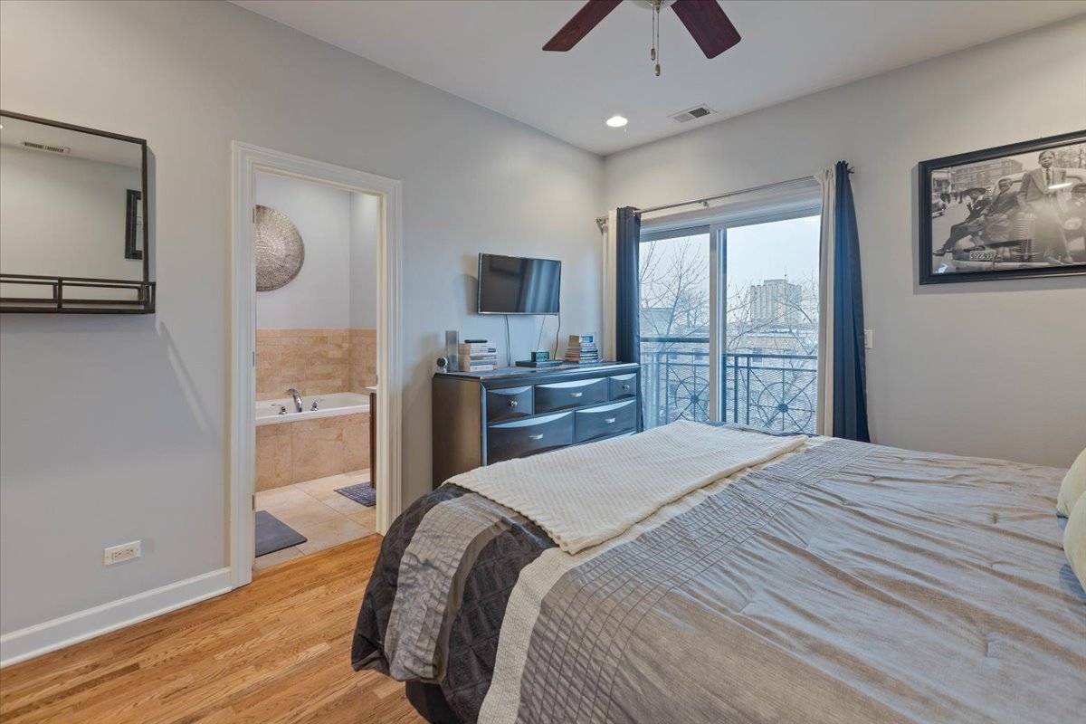 2130 West Rice Street, Unit 4 Chicago, IL 60622 - Photo 20 of 35 a bedroom with a bed and a large window