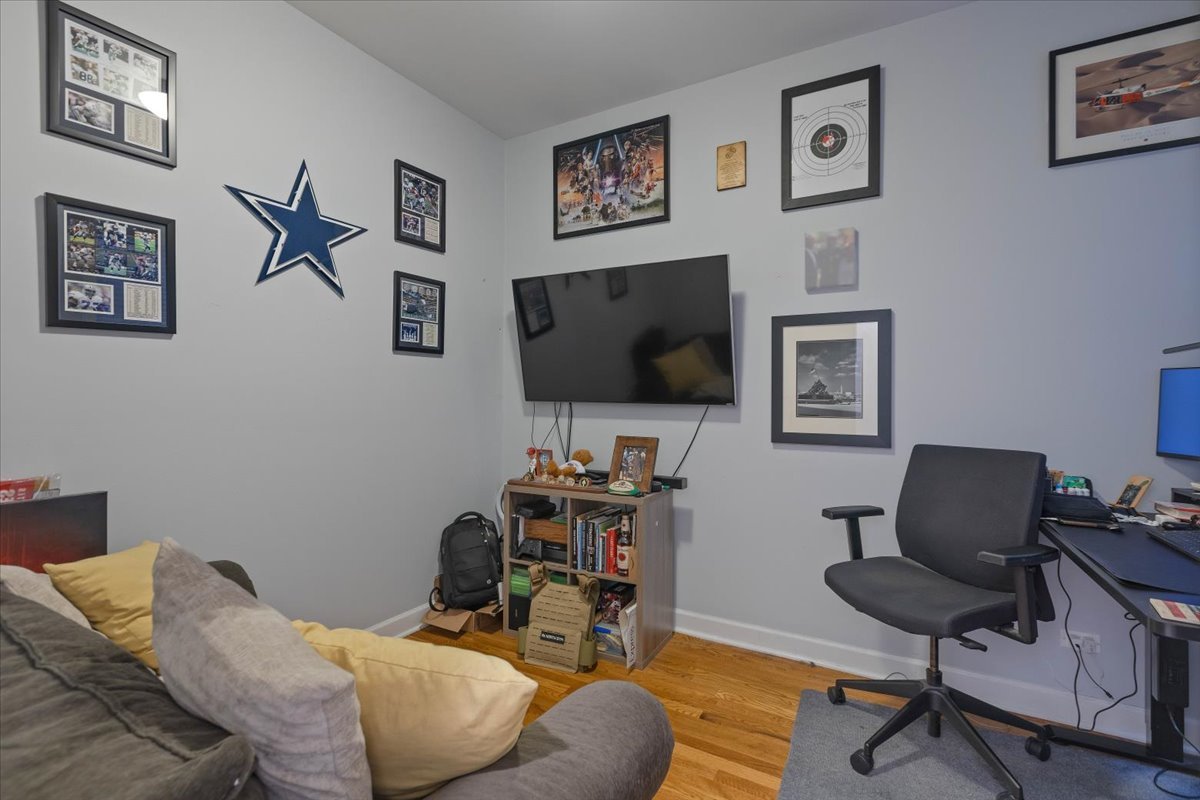 2130 West Rice Street, Unit 4 Chicago, IL 60622 - Photo 27 of 35 a living room with furniture and a flat screen tv
