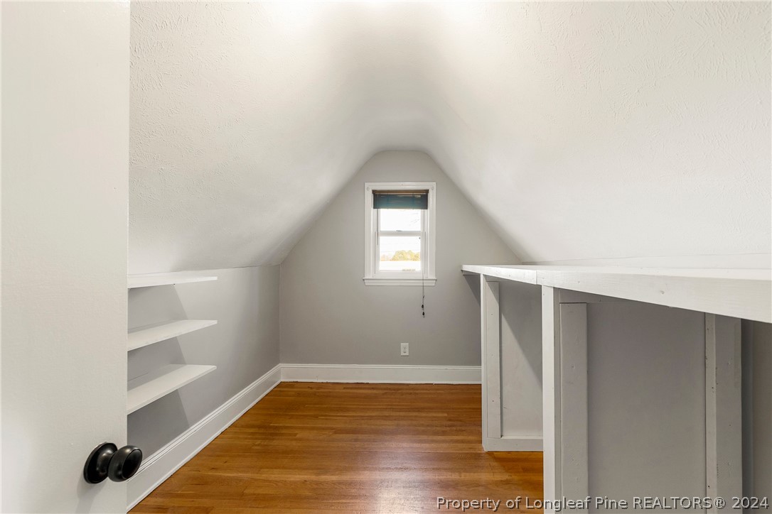 1700 Cedar Creek Road Fayetteville, NC 28312 - Photo 19 of 21 a view of a hallway with wooden floor and closet