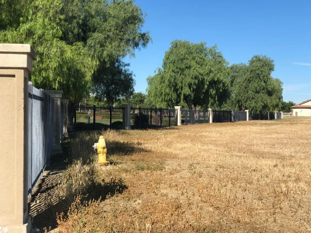 a swimming pool with an outdoor space and seating area