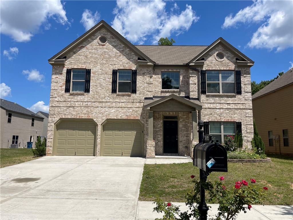 3495 Zaks Way Bethlehem, GA 30620 - Photo 1 of 1 a front view of a house with a garden and yard