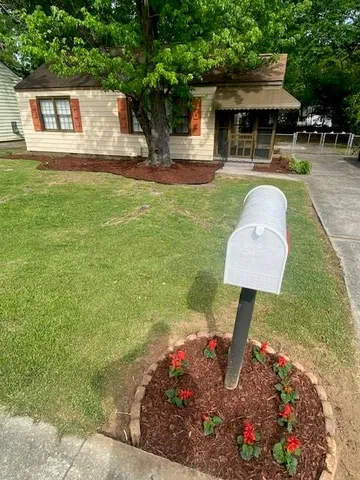 a front view of a house with a yard table and chairs