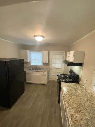 a bedroom with a bed and dresser