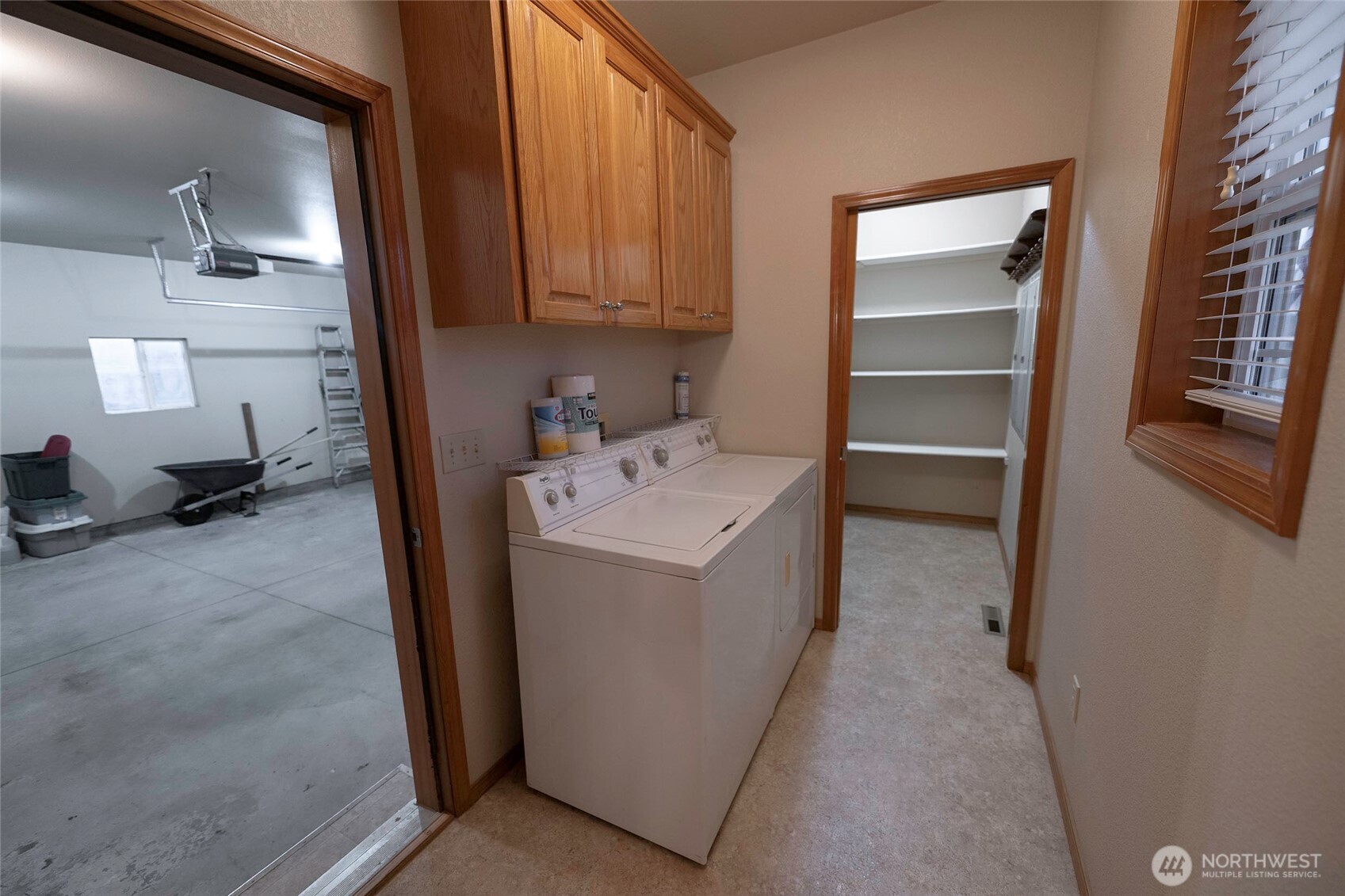6279 Touchet North Road Touchet, WA 99360 - Photo 18 of 34 a utility room with cabinets washer and dryer
