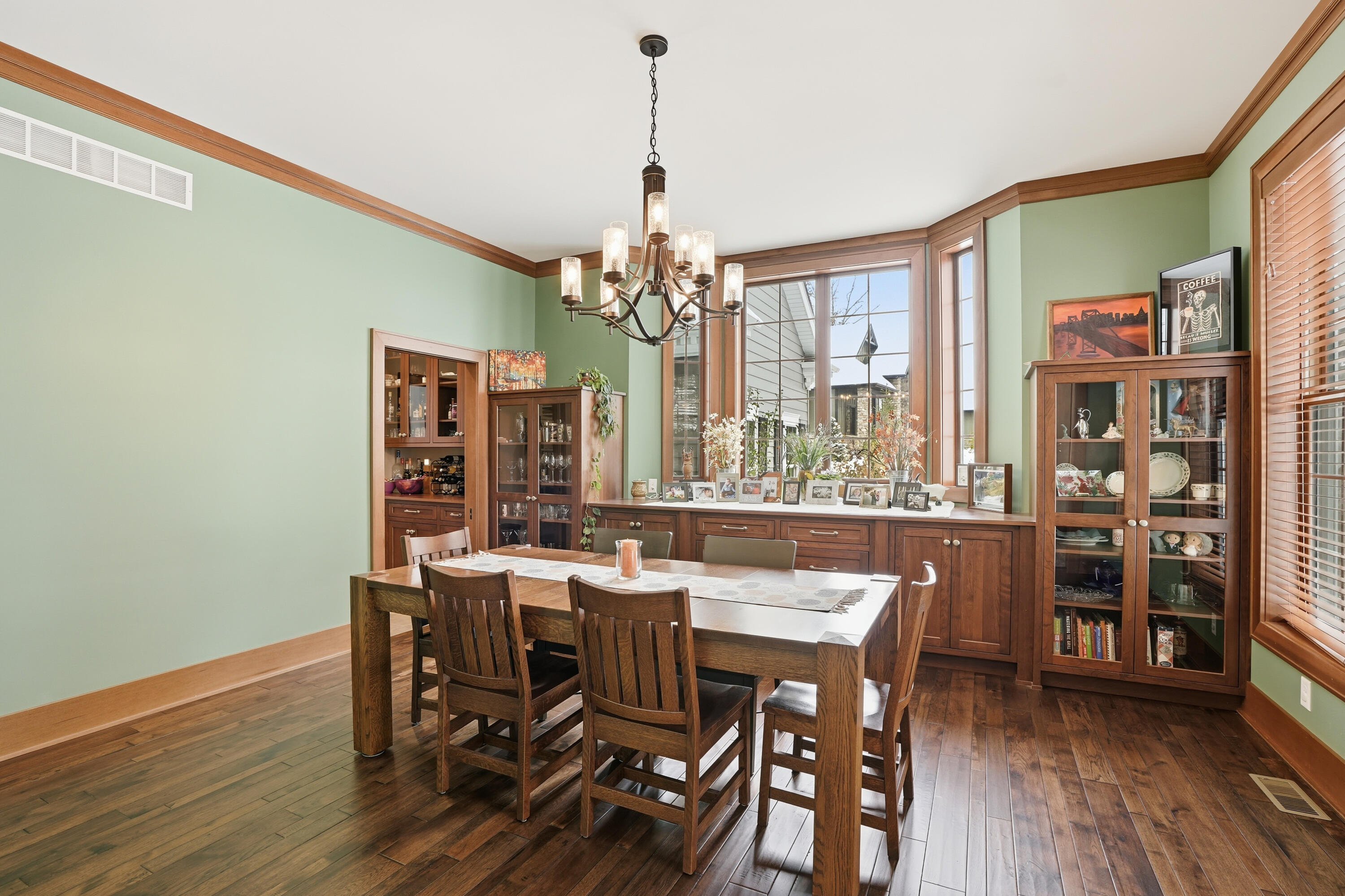 804 Shannon Drive Crown Point, IN 46307 - Photo 11 of 71 a view of a dining room with furniture and wooden floor