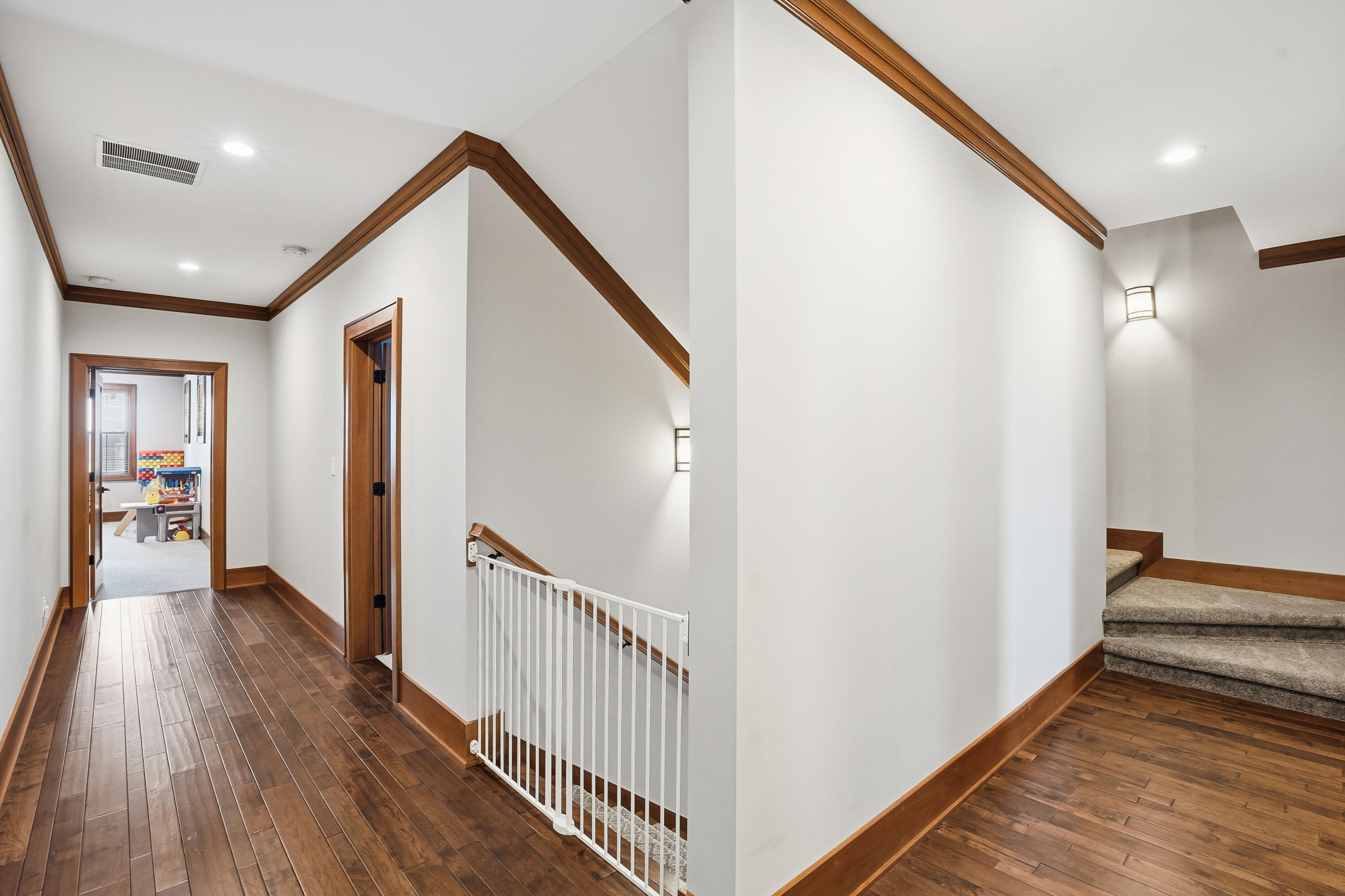 804 Shannon Drive Crown Point, IN 46307 - Photo 36 of 71 a view of a hallway with wooden floor and staircase