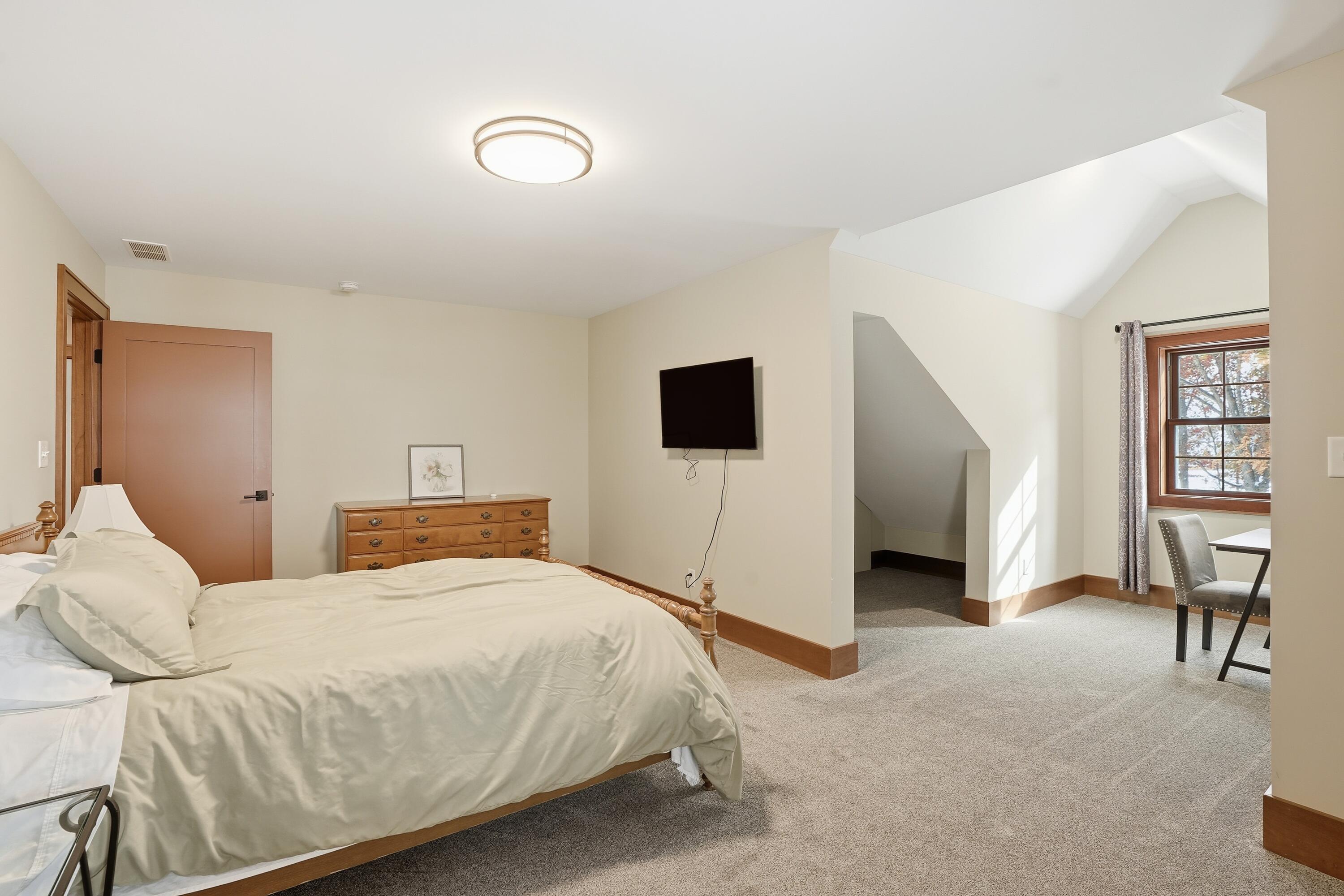 804 Shannon Drive Crown Point, IN 46307 - Photo 55 of 71 a bedroom with a bed and a flat screen tv