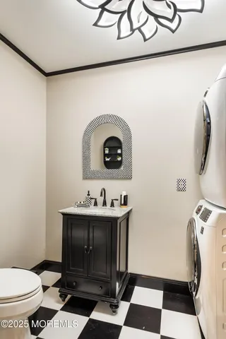 a bathroom with a sink a toilet and a mirror