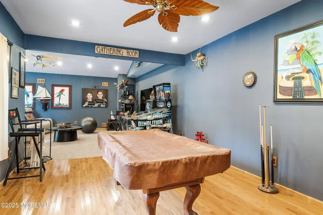 a view of a dining room with furniture and a flat screen tv