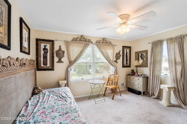 a bedroom with furniture and a window