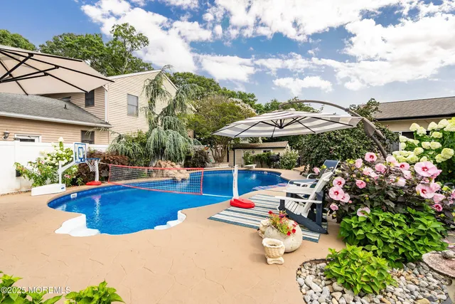 a view of a swimming pool with a lounge chairs