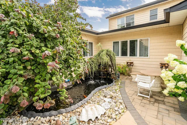 a view of a backyard with chairs
