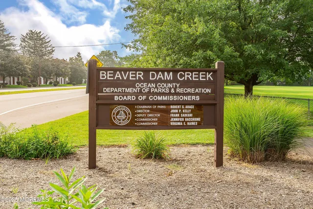 a view of a sign board with a park