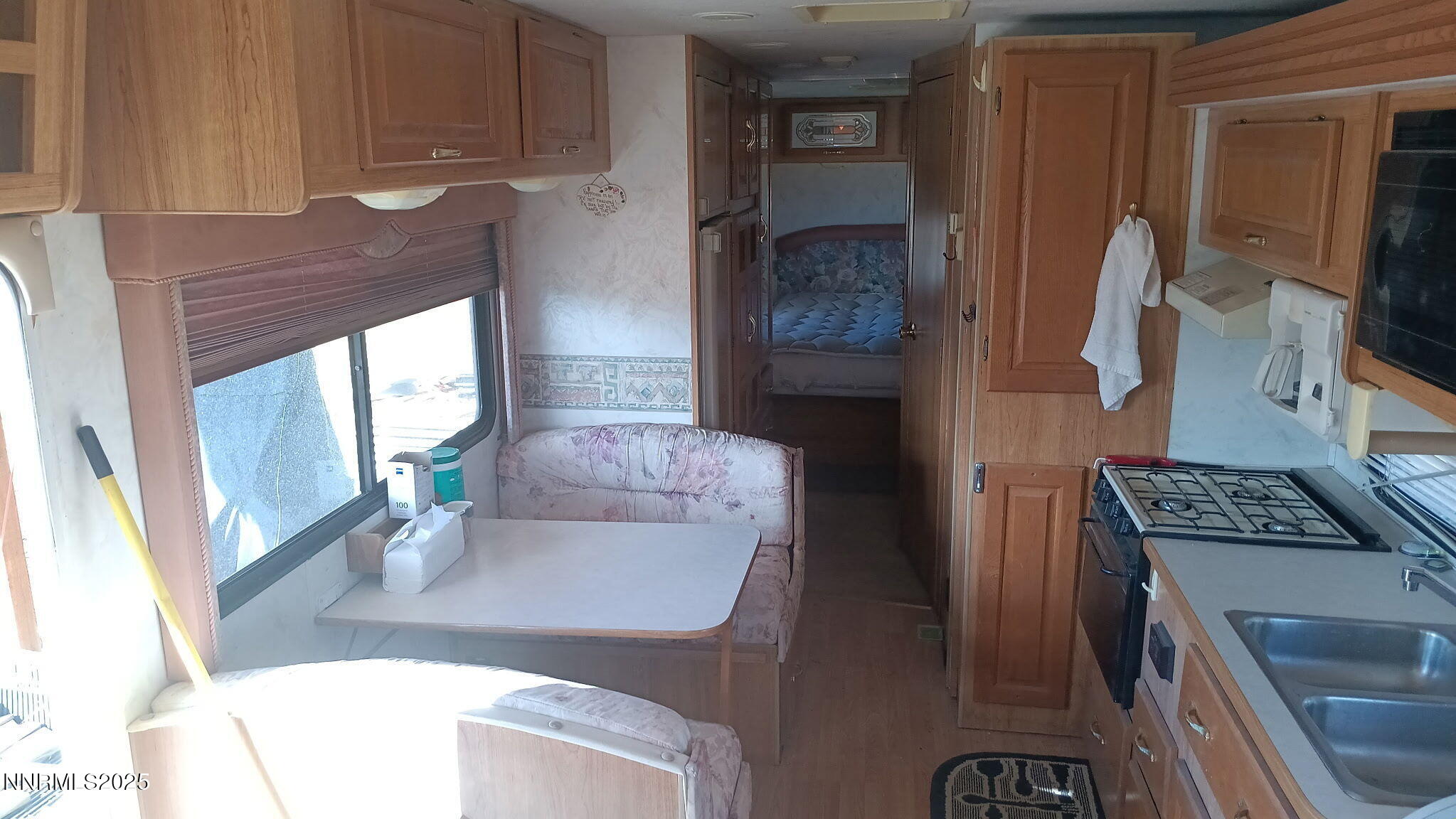 10355 Bobcat Road Winnemucca, NV 89445 - Photo 11 of 14 a kitchen with a sink a stove and a refrigerator