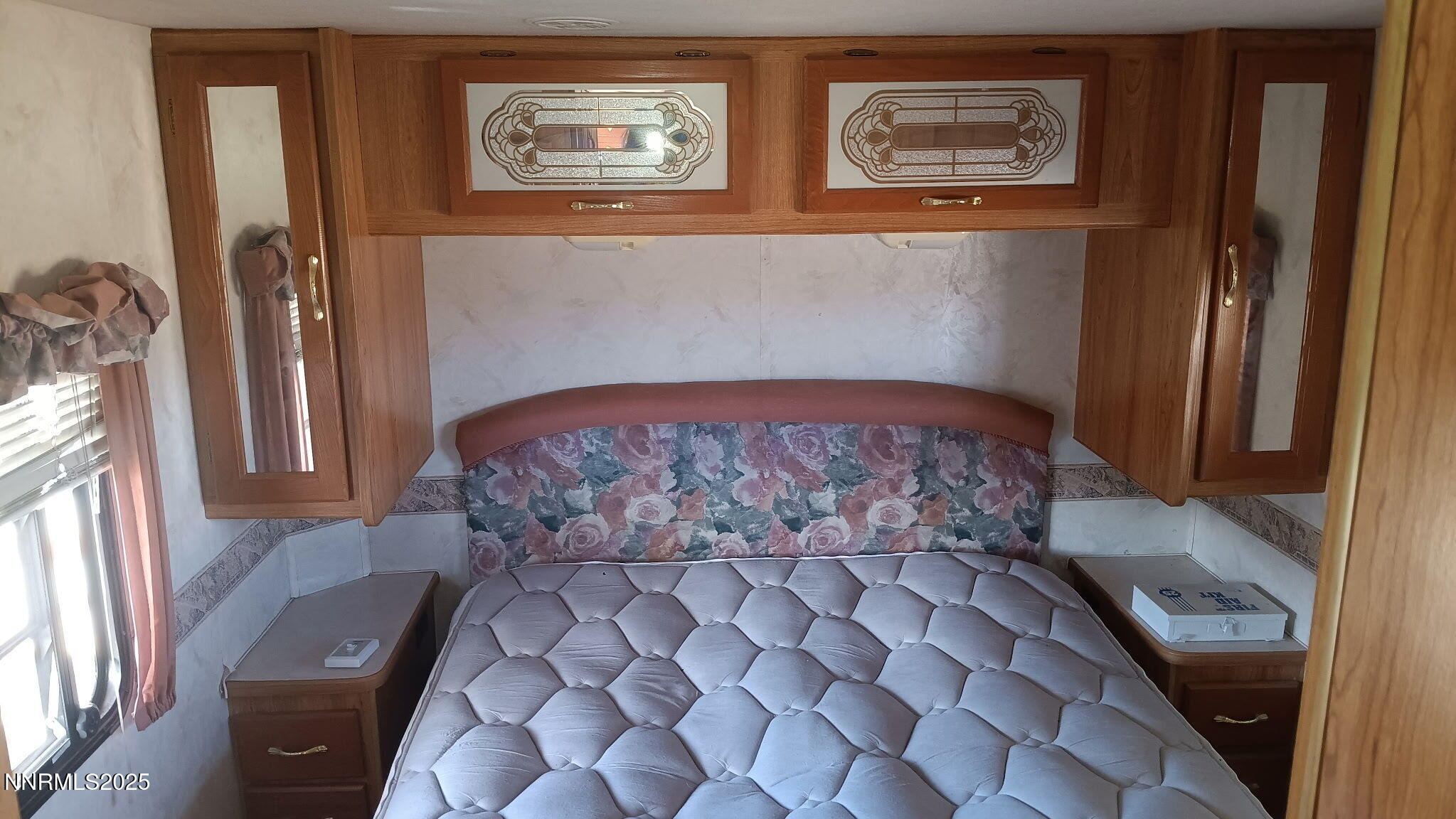 10355 Bobcat Road Winnemucca, NV 89445 - Photo 13 of 14 a large bed sitting in a bedroom next to a window