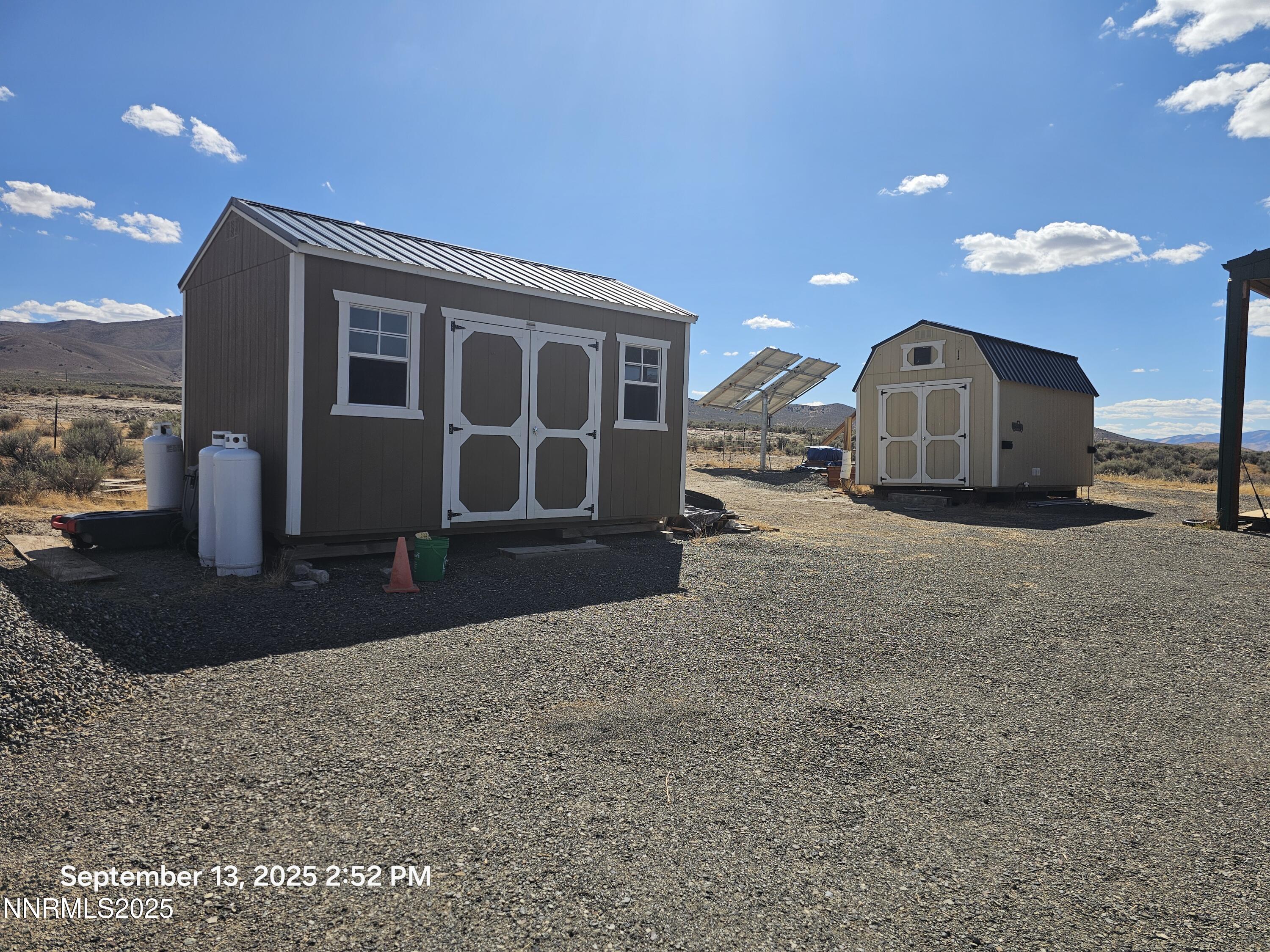 10355 Bobcat Road Winnemucca, NV 89445 - Photo 3 of 14 a view of a house with a yard