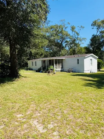 a view of a swimming pool with an outdoor seating