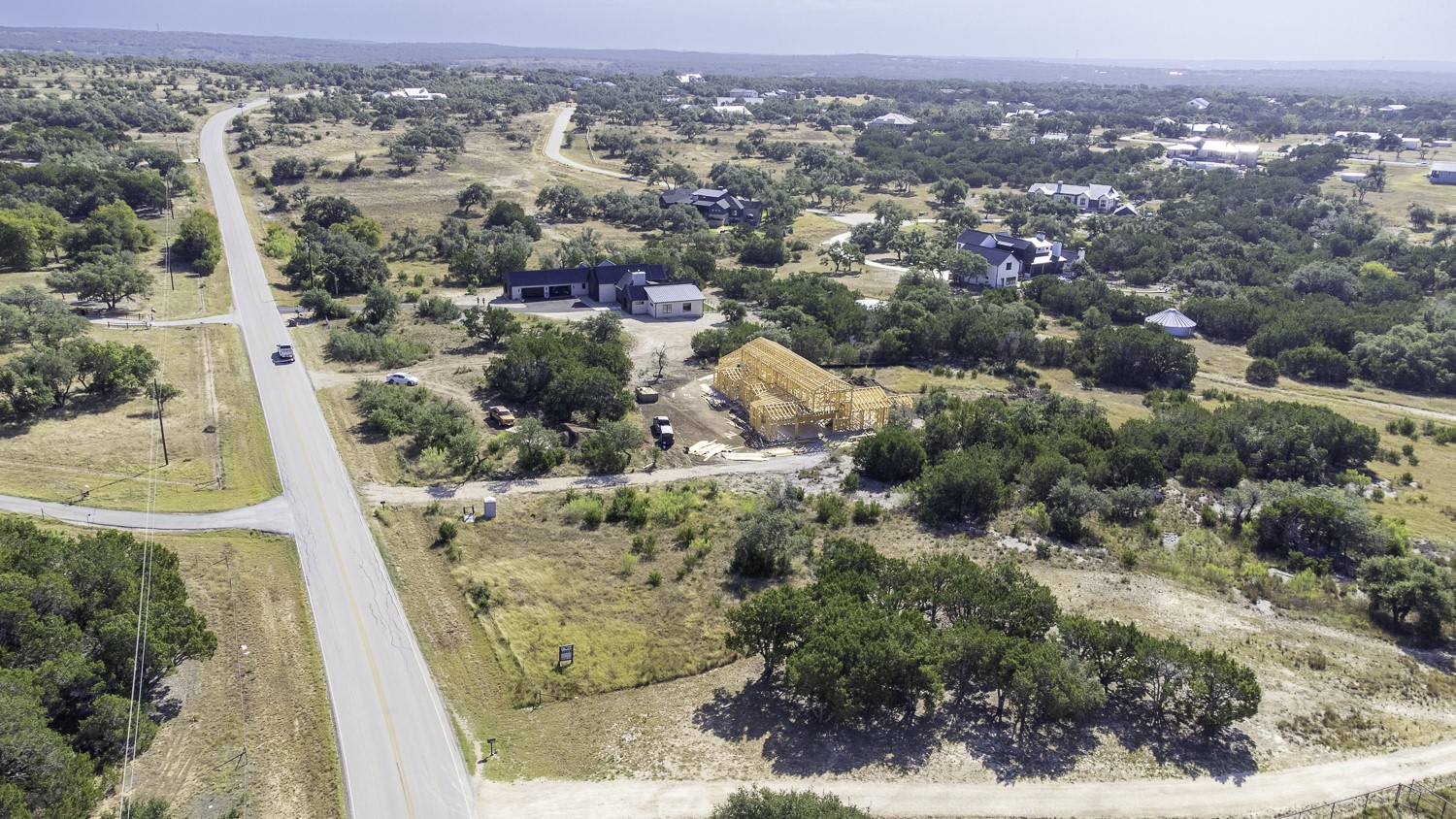 2251 West Fitzhugh Road Dripping Springs, TX 78620 - Photo 3 of 16 an aerial view of a house with a yard