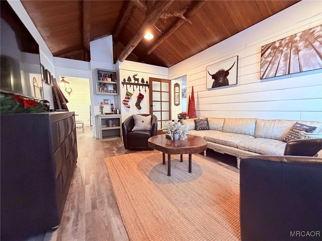 926 Kuffle Canyon Road Skyforest, CA 92385 - Photo 22 of 35 a living room with furniture a flat screen tv and a table