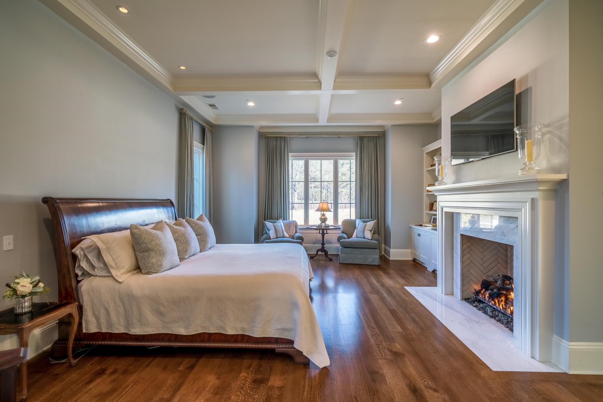 248 Dubray Manor Drive Collierville, TN 38017 - Photo 13 of 25 a spacious bedroom with a bed and a television