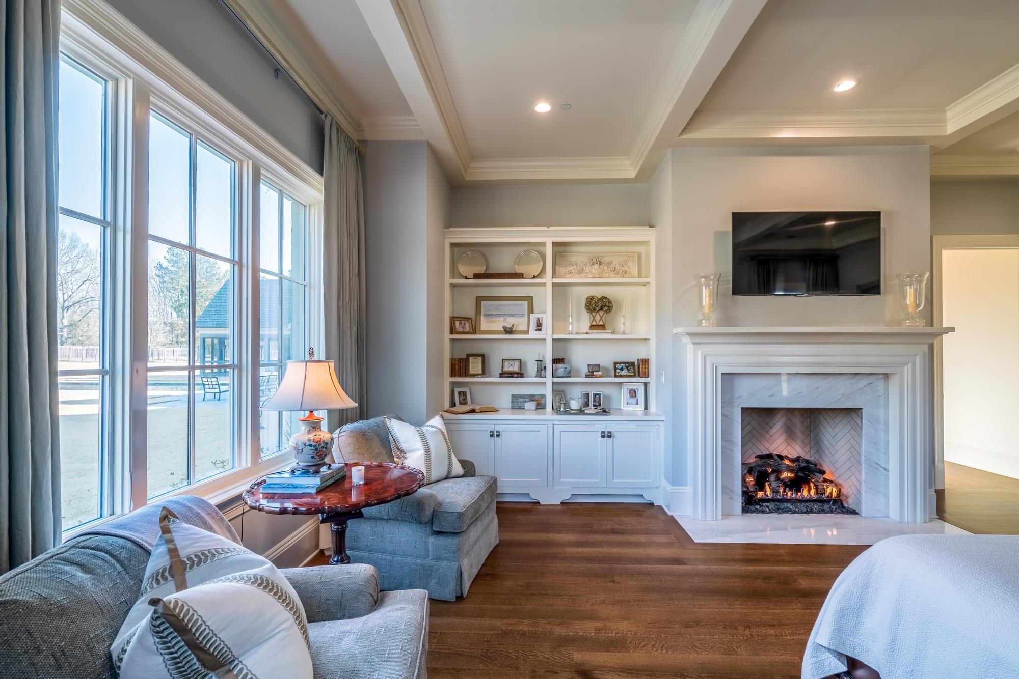 248 Dubray Manor Drive Collierville, TN 38017 - Photo 14 of 25 a living room with furniture a fireplace and a flat screen tv