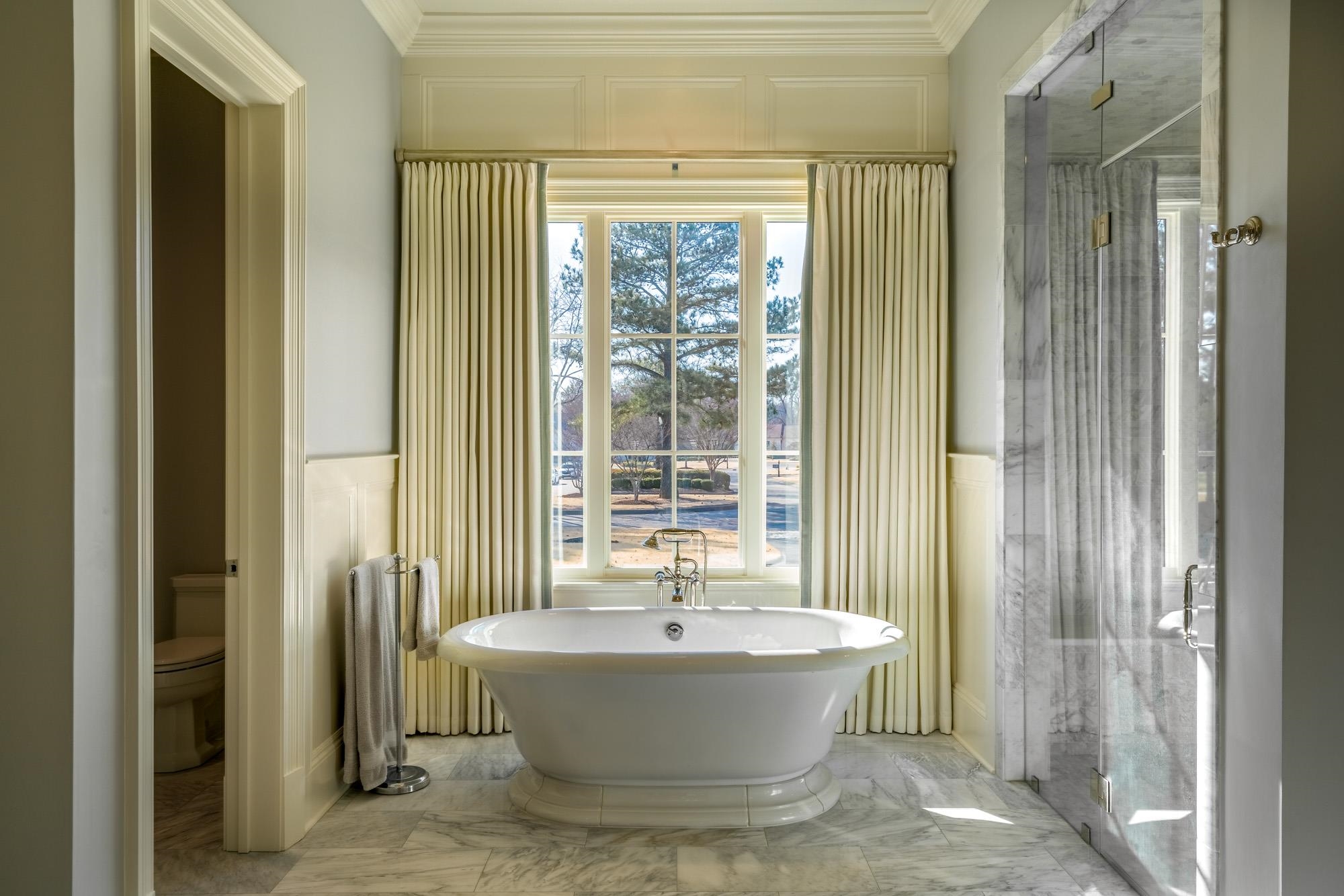 248 Dubray Manor Drive Collierville, TN 38017 - Photo 15 of 25 a bathroom with a bathtub and shower