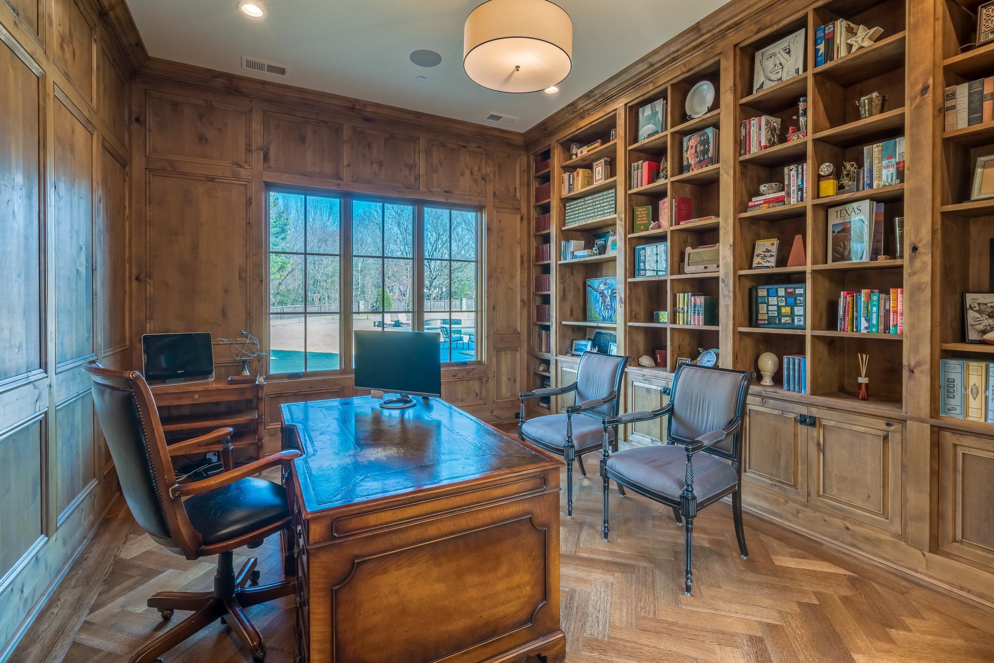 248 Dubray Manor Drive Collierville, TN 38017 - Photo 18 of 25 a view of a workspace with furniture and a bookshelf