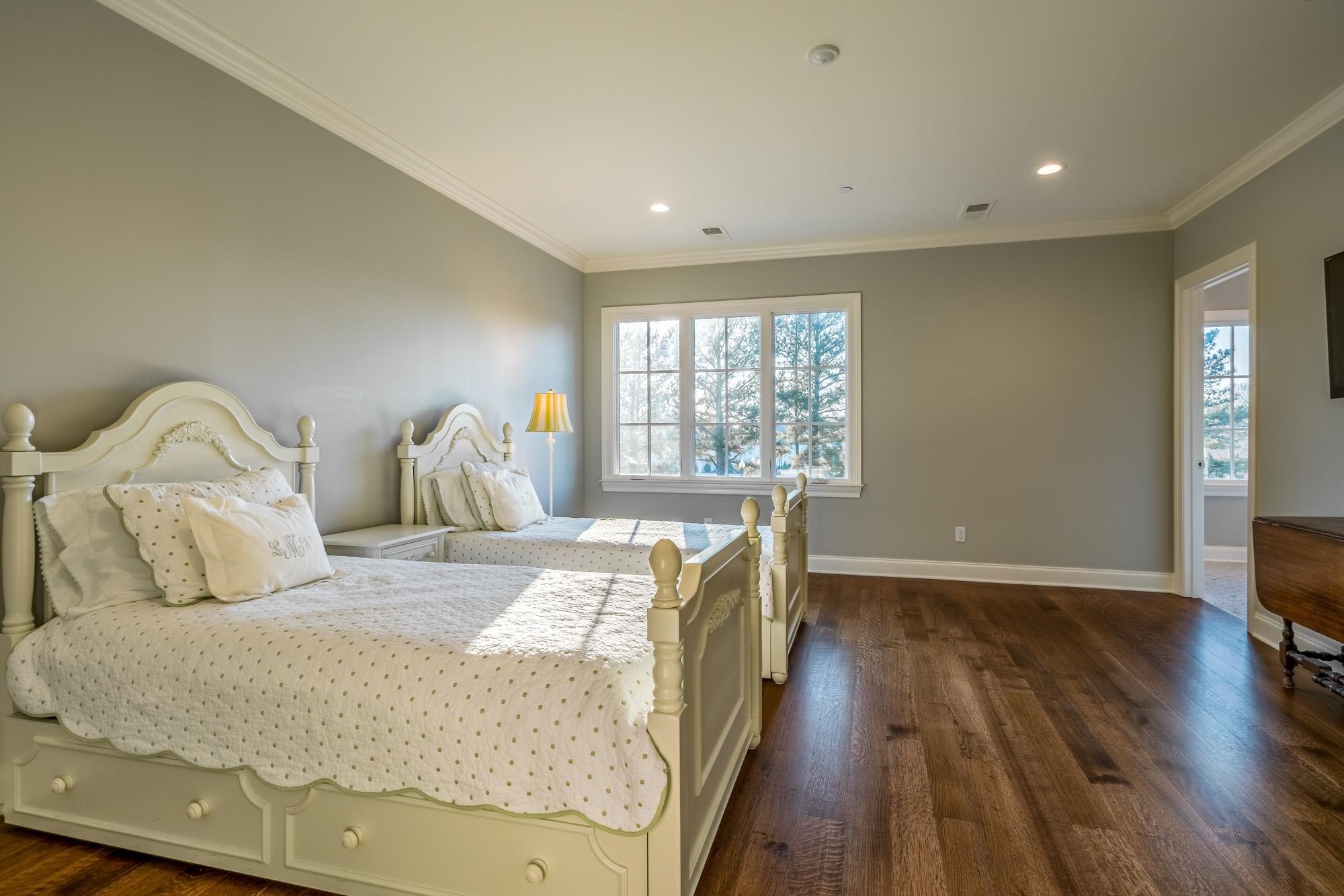 248 Dubray Manor Drive Collierville, TN 38017 - Photo 22 of 25 a bedroom with a bed and wooden floor