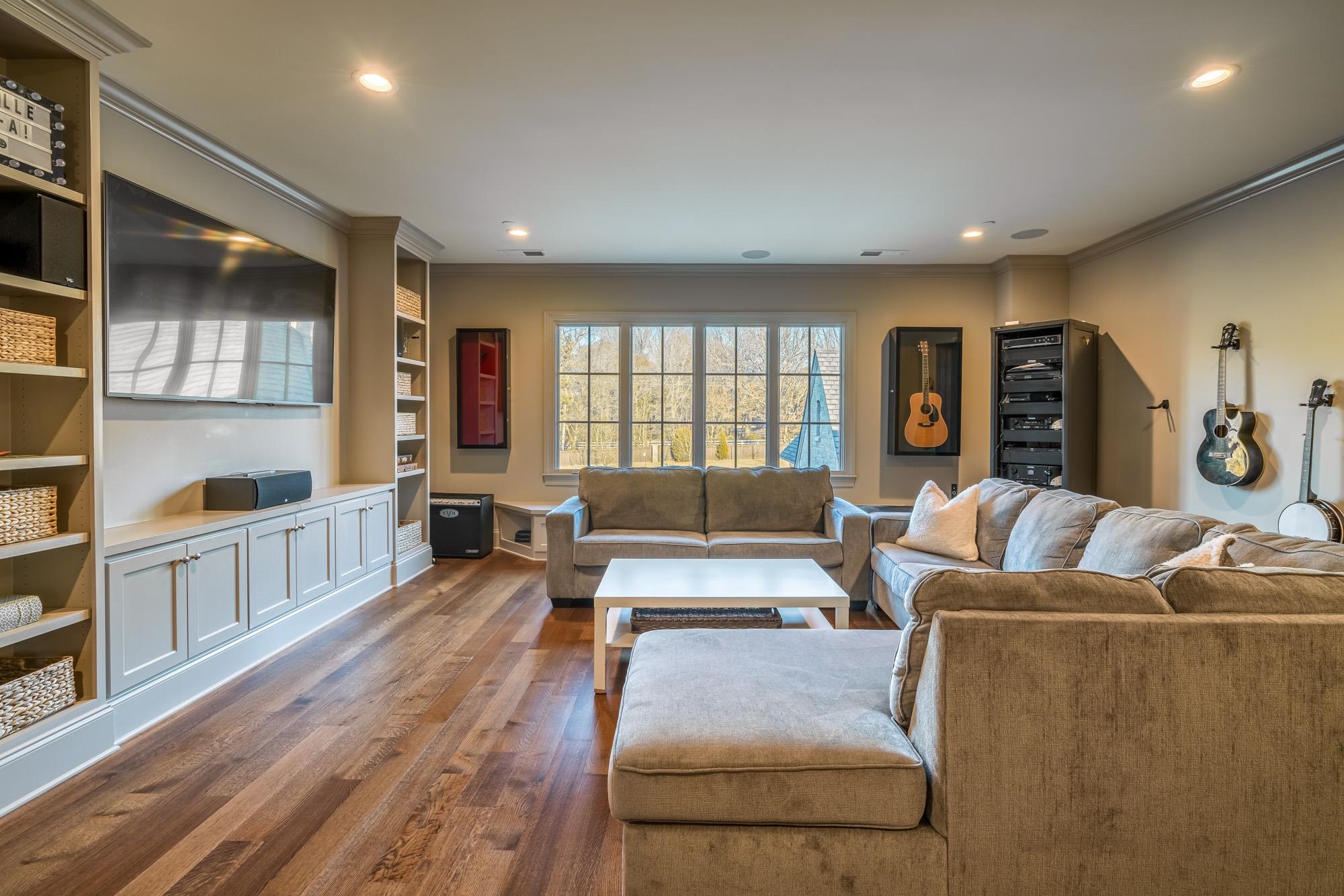 248 Dubray Manor Drive Collierville, TN 38017 - Photo 24 of 25 a living room with furniture window and wooden floor