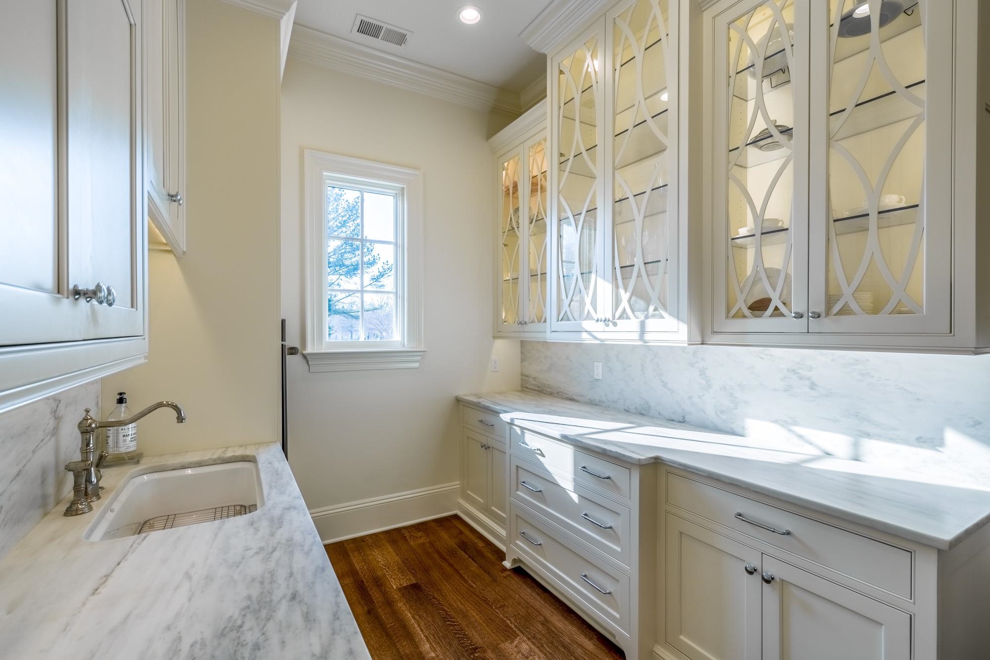 248 Dubray Manor Drive Collierville, TN 38017 - Photo 9 of 25 a bathroom with a sink and a bathtub next to a window