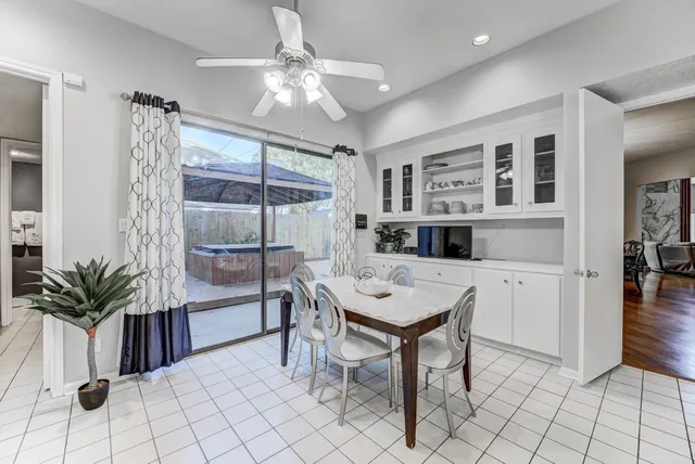 a living room with furniture a rug and a large window