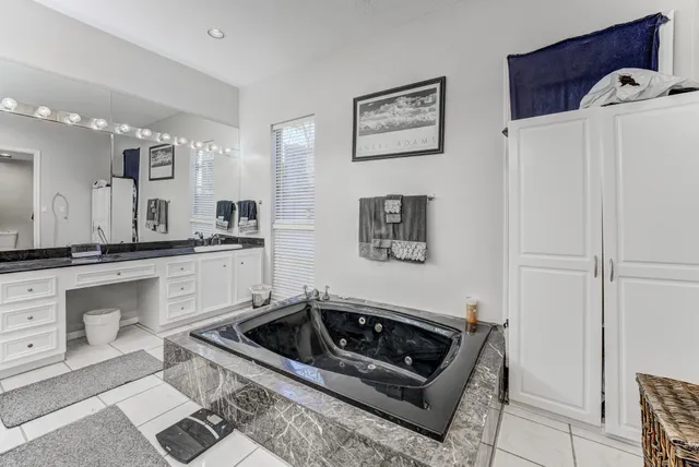 a living room with furniture and large window