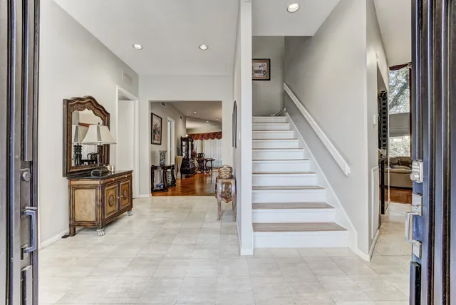 a view of a room with a potted plant and a large window