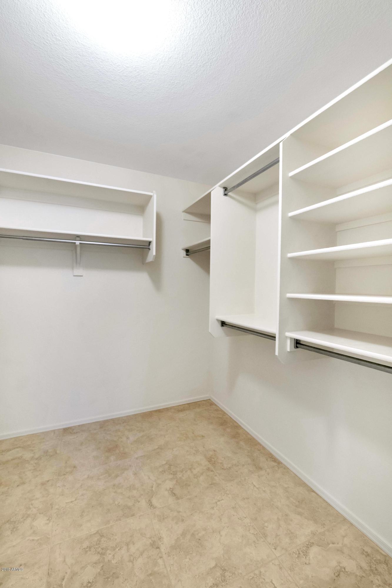 2082 East Smoke Tree Road Gilbert, AZ 85296 - Photo 18 of 34 Spacious Master Walk-In Closet