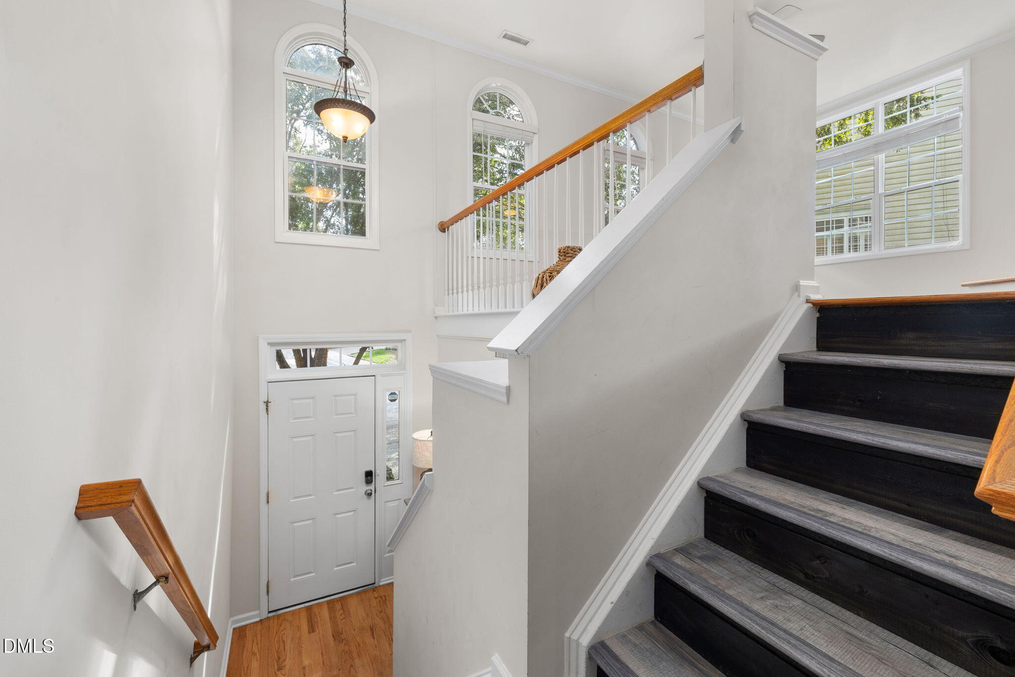 6901 Middleboro Drive Raleigh, NC 27612 - Photo 10 of 42 a view of entryway and hall with wooden floor