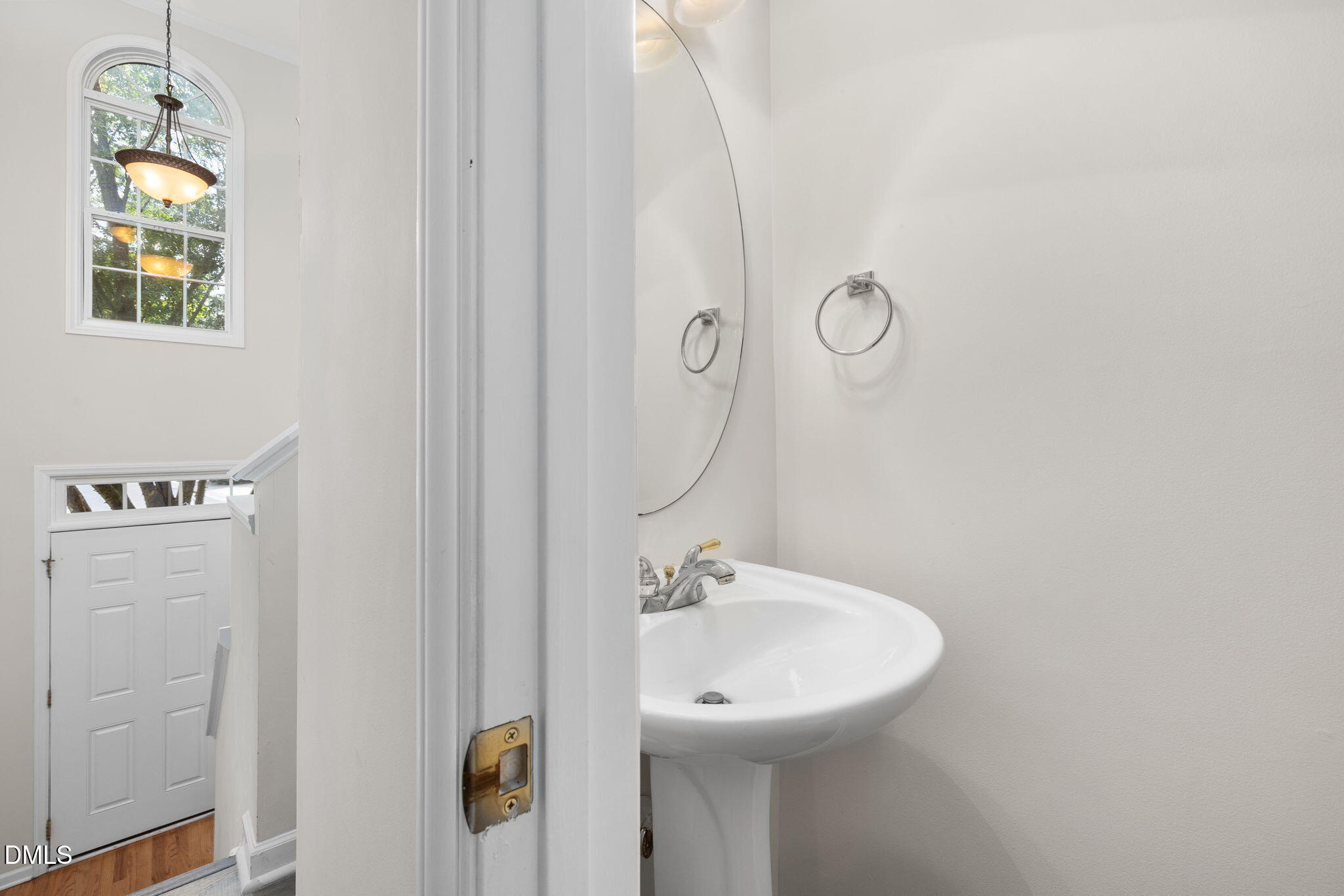 6901 Middleboro Drive Raleigh, NC 27612 - Photo 11 of 42 a bathroom with a sink and mirror