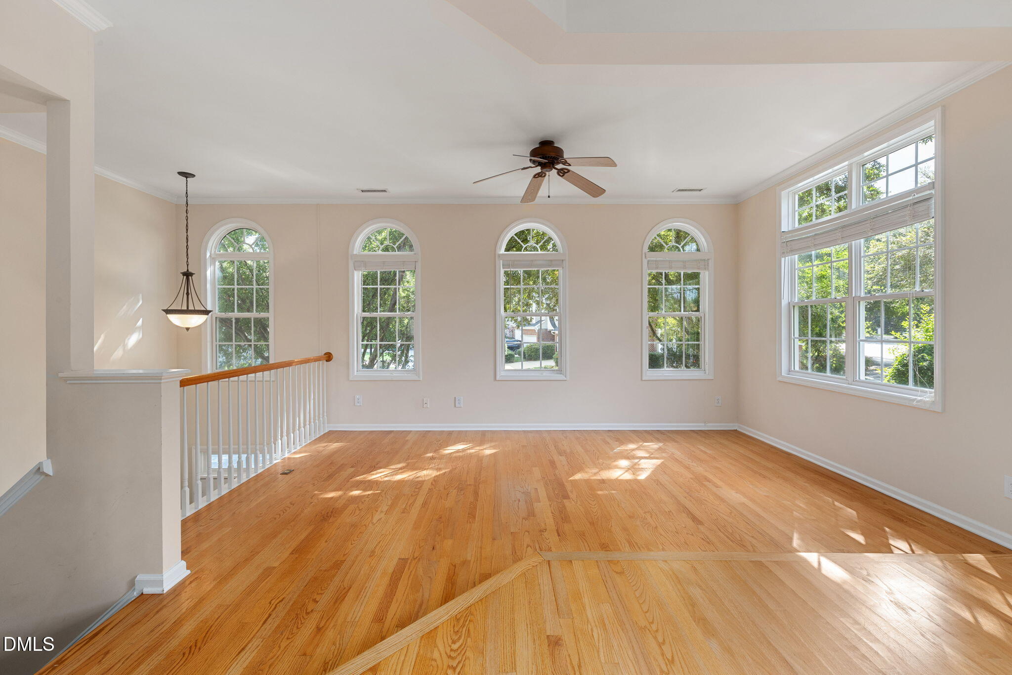 6901 Middleboro Drive Raleigh, NC 27612 - Photo 13 of 42 a view of an empty room and window with wooden floor