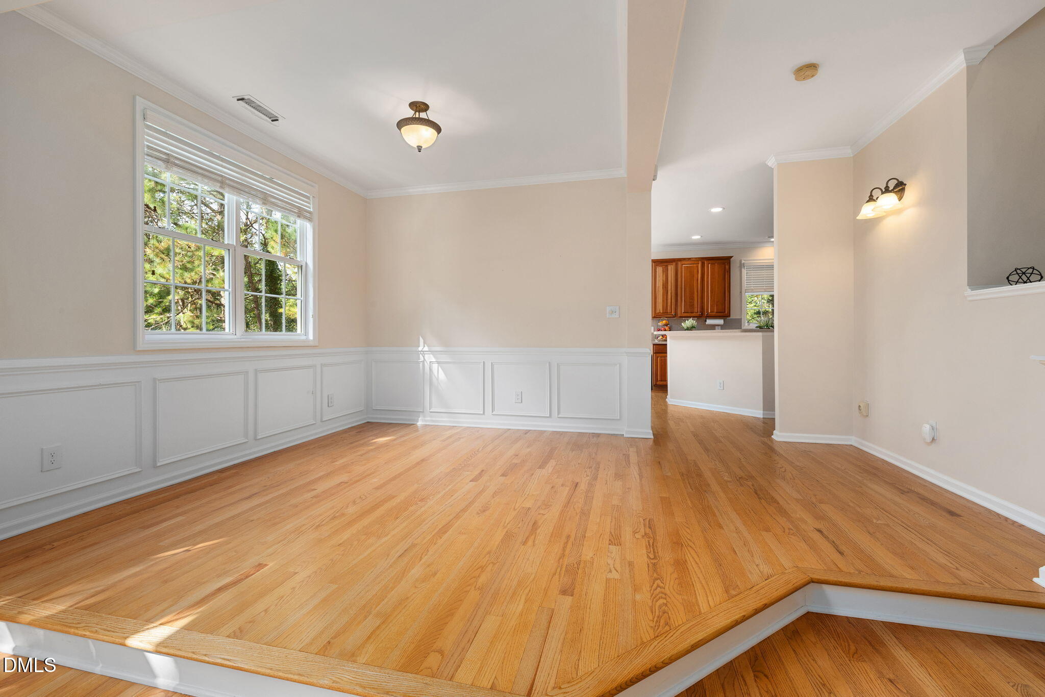 6901 Middleboro Drive Raleigh, NC 27612 - Photo 16 of 42 a view of empty room with wooden floor and fan