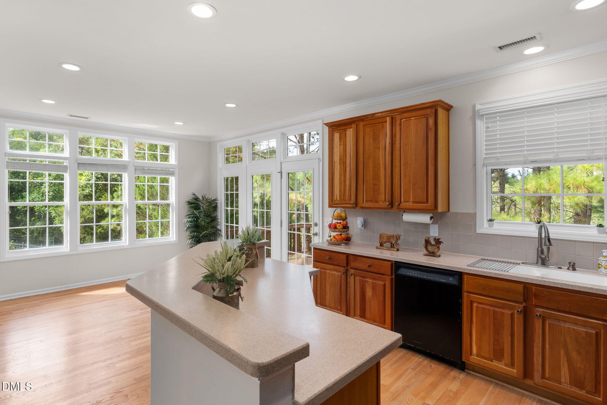 6901 Middleboro Drive Raleigh, NC 27612 - Photo 19 of 42 a kitchen with a sink and a large window