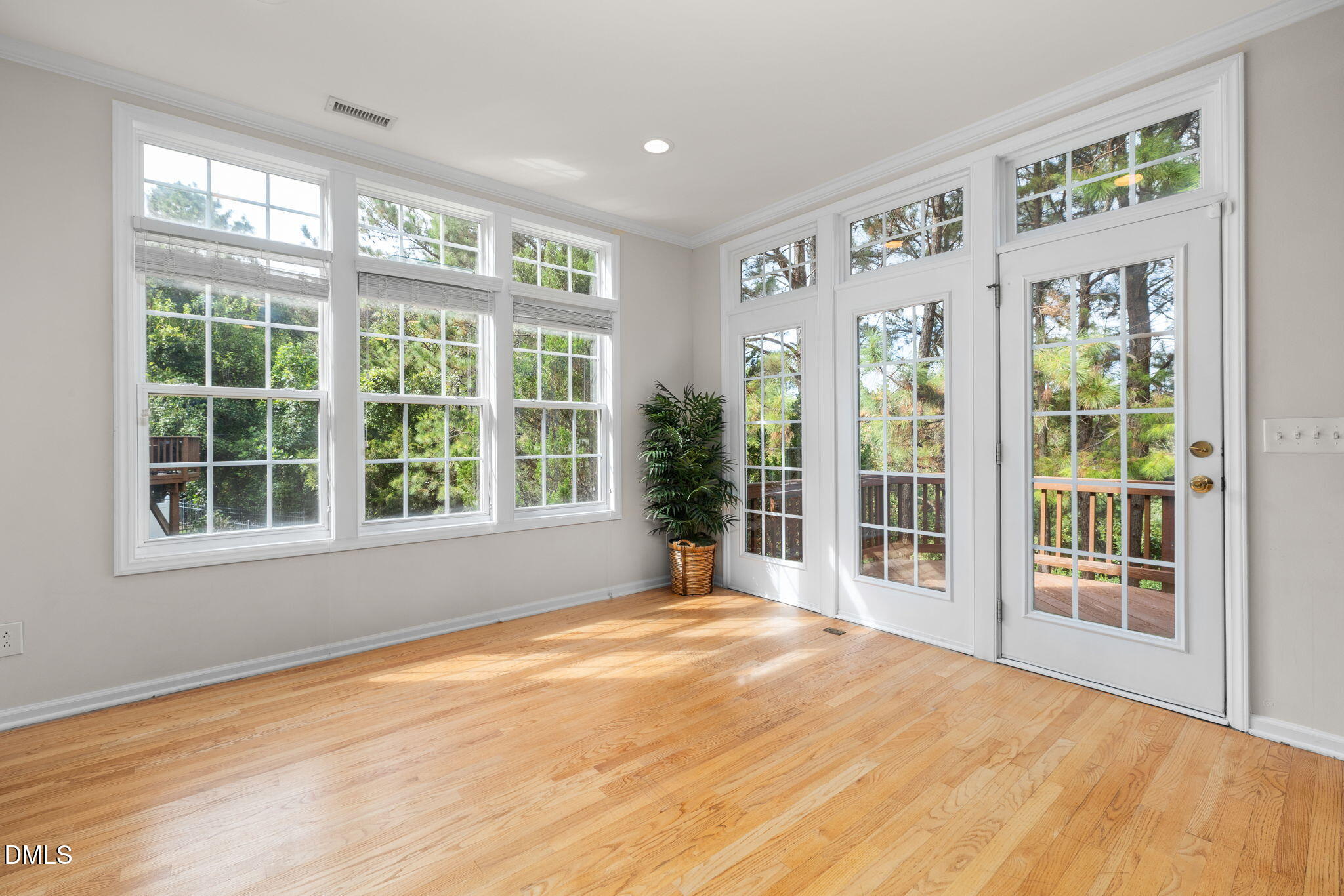 6901 Middleboro Drive Raleigh, NC 27612 - Photo 21 of 42 a view of an empty room with wooden floor and a window