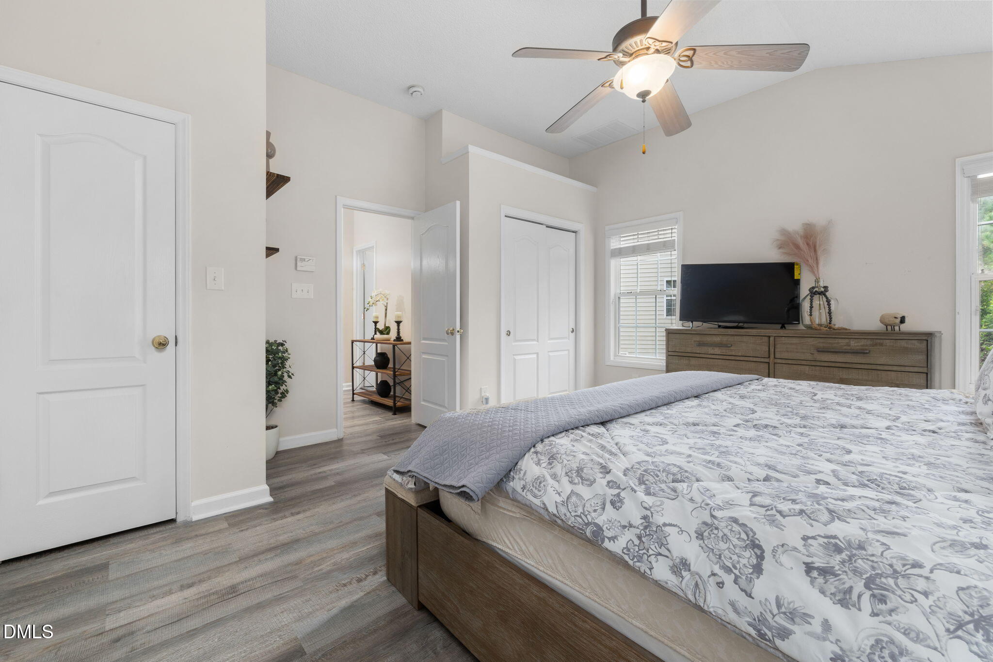 6901 Middleboro Drive Raleigh, NC 27612 - Photo 25 of 42 a bedroom with a bed and a flat tv screen on dresser