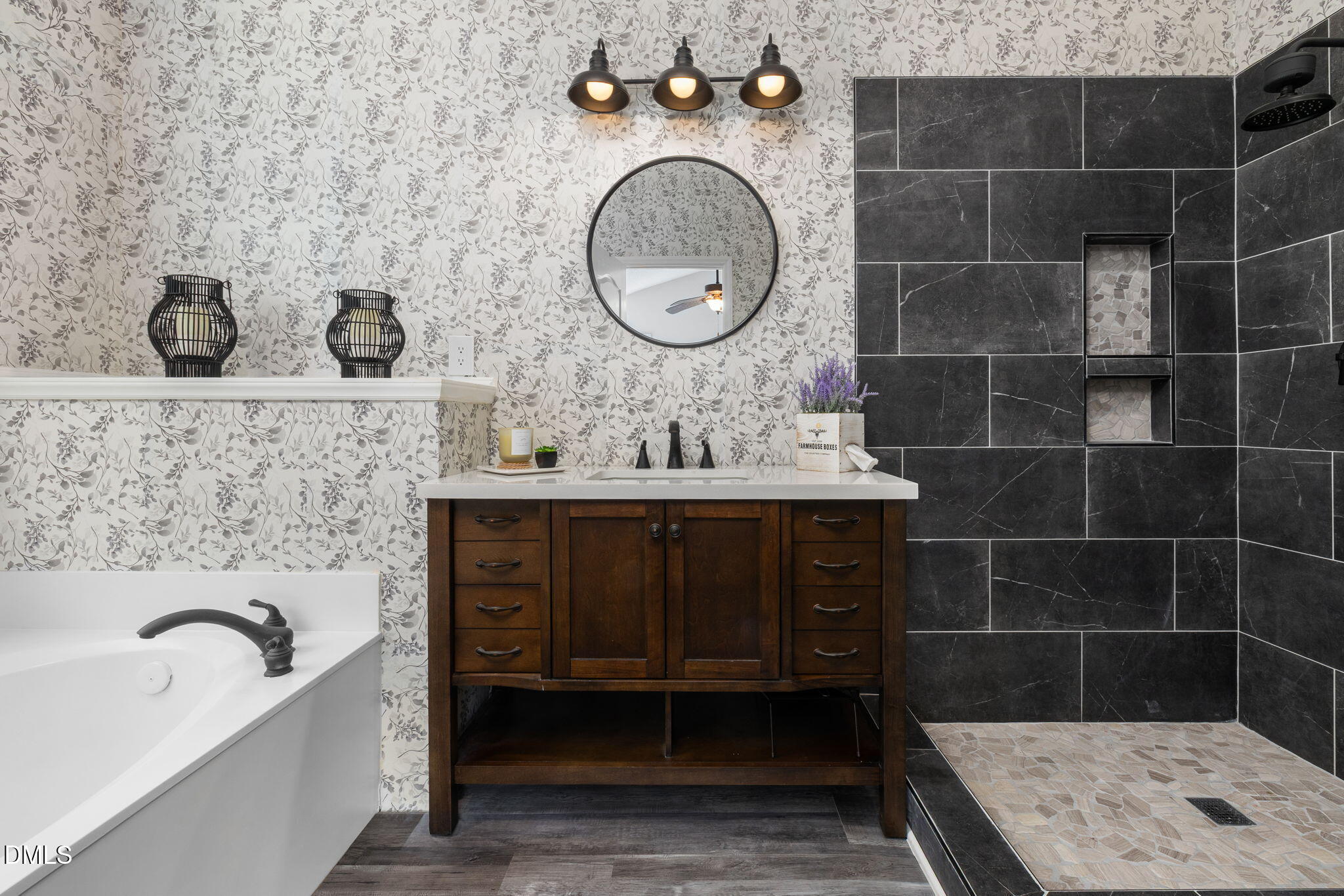 6901 Middleboro Drive Raleigh, NC 27612 - Photo 26 of 42 a bathroom with a granite countertop sink a mirror and bathtub