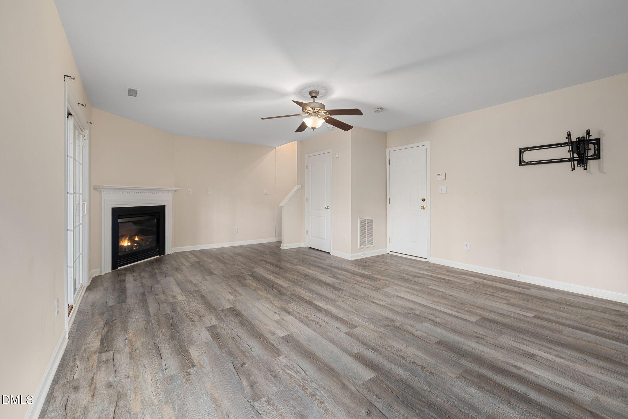 6901 Middleboro Drive Raleigh, NC 27612 - Photo 35 of 42 wooden floor in an empty room with a fan